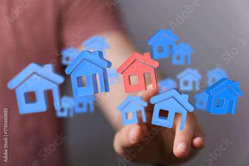 Hand touching homes,  real ...