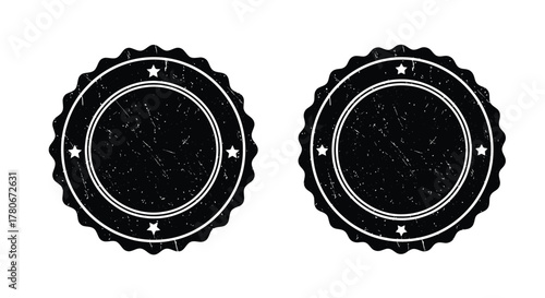 Two vintage black seals with star motifs and ornate borders displayed