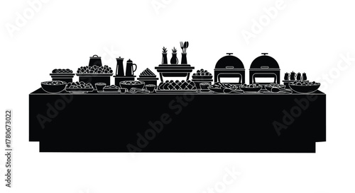 A silhouetted buffet table laden with various dishes and serving containers