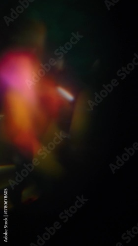 Sun glare, lens flare on a black background for transition to video. Colored rays