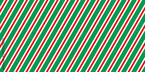 Christmas seamless pattern. Red and green diagonal stripes background. Candy cane repeating decoration wallpaper. Winter holiday lines backdrop. vector