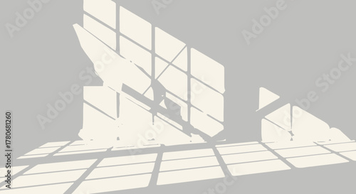 Window light patterns casting geometric shapes and abstract forms on a neutral surface