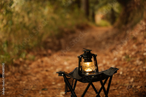 Autumn forest, lantern light, camping