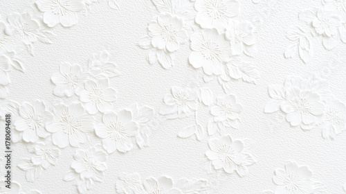花模様がエンボス加工された白い紙のテクスチャ
