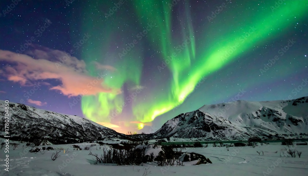 Naklejka premium Northern Lights dance over snowy mountains, illuminating a winter landscape under a starry night sky
