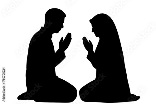 Silhouette of a couple kneeling in prayer, emphasizing devotion and faith
