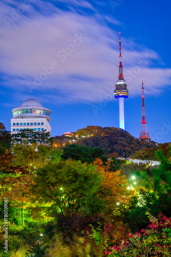 The best night view of Namsan Park, with beautiful autumn leaves and clouds at Seoul Tower.