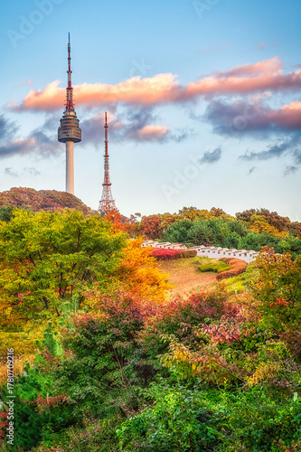 The best viewpoint in Namsan Park during the autumn leaves and beautiful clouds at Seoul Tower.