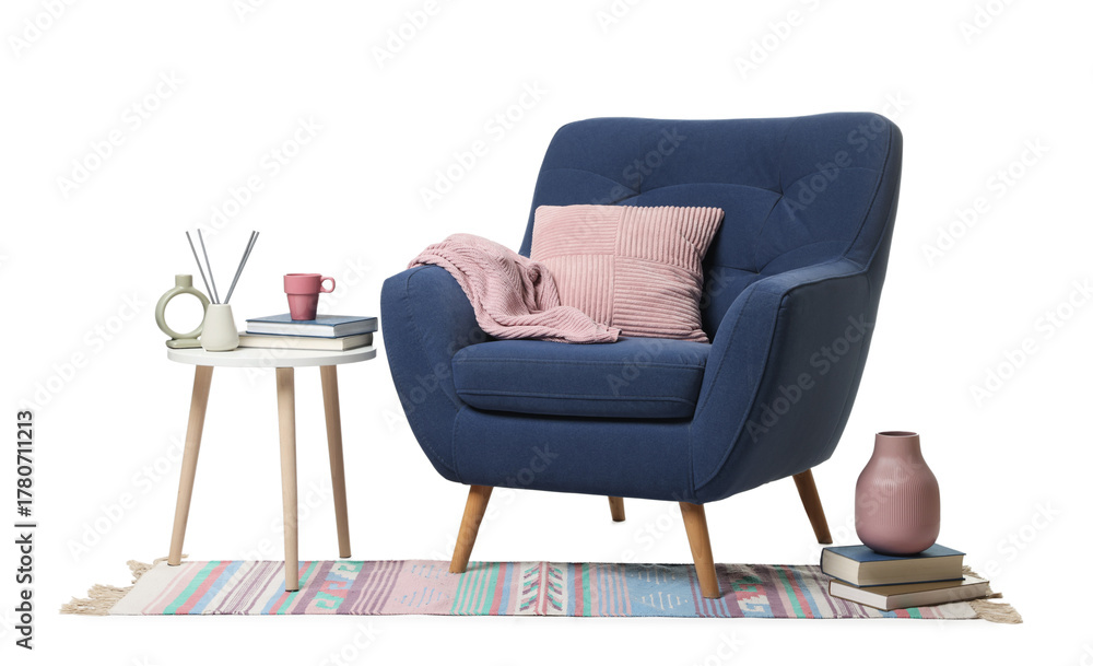 Fototapeta premium Blue armchair, pillow, blanket, side table and rug isolated on white