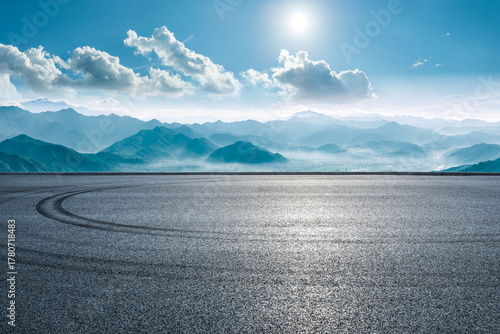 Fototapeta Naklejka Na Ścianę i Meble -  Empty asphalt road with green mountain range natural landscape in the morning