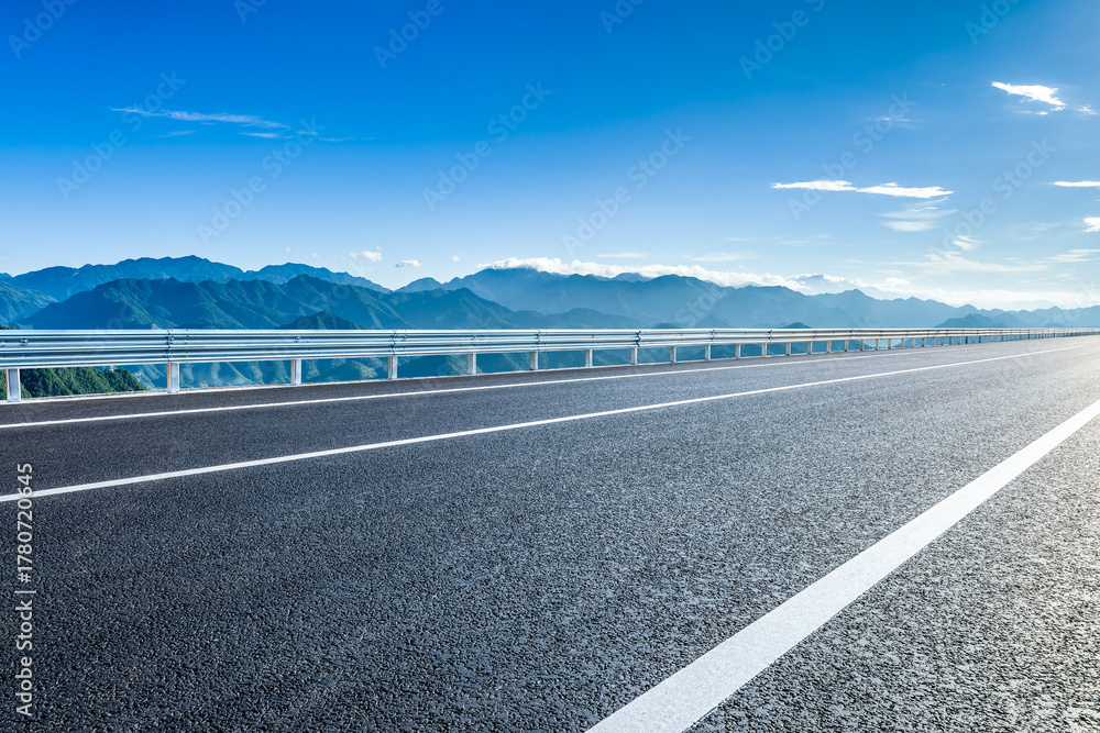 Fototapeta premium Empty asphalt highway road and beautiful mountain natural landscape in the morning