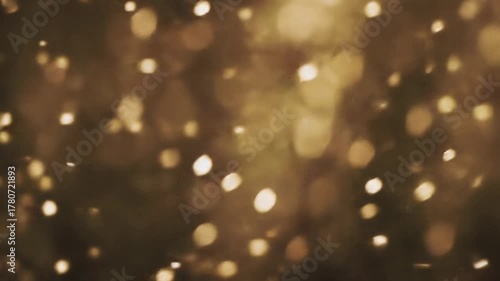 hundreds of abstract, shimmering dust motes gently drift in extreme slow-motion against a warm, blurred bokeh background, evoking peaceful wonder