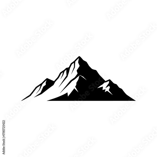 Majestic mountain peak rises sharply against a clear sky, showcasing its rugged beauty and challenging terrain, evoking a sense of adventure and wilderness.