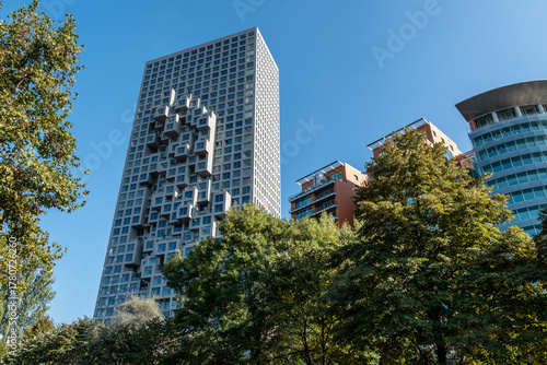 Wallpaper Mural Moderner Wolkenkratzer mit markanter Fassadenstruktur neben Wohnbauten, Tirana, Albanien Torontodigital.ca