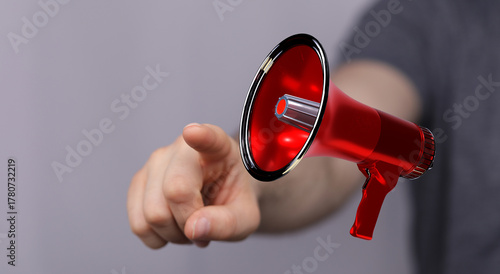Hand pointing towards a red...