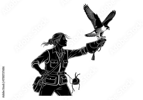 A hunter in action holds a bird of prey in mid-air with a glove on hand