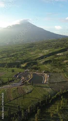 Aerial View Of Terraced Vineyard And Modern Visitor Complex In Mountainous Valley During Golden Hour