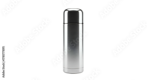 Polished metal thermal flask stands isolated against a deep black background
