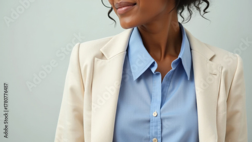 Formal and Elegant Black Suit Detail: Close-up of a man in a stylish, all-black tuxedo or suit, complete with a satin lapel, black shirt, tie, and pocket square.