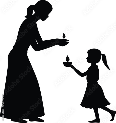 Woman lighting candle for child silhouette