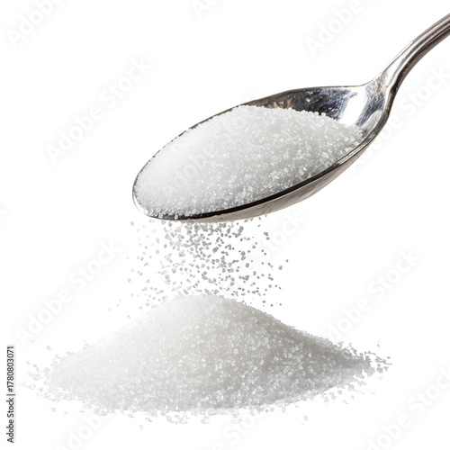  Granulated sugar falling from metal spoon scoop, close-up food ingredient concept. Isolated on white or transparent background