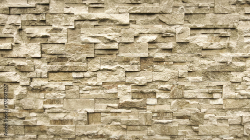 Realistic Stacked Stone Wall Texture Background - Rustic Beige Slate Veneer Close-Up.
High-resolution, photorealistic texture showcasing a section of a natural stacked stone wall. The surface features