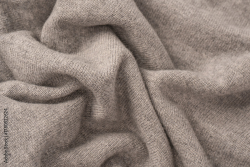 Soft grey merino wool sweater texture as a background.
