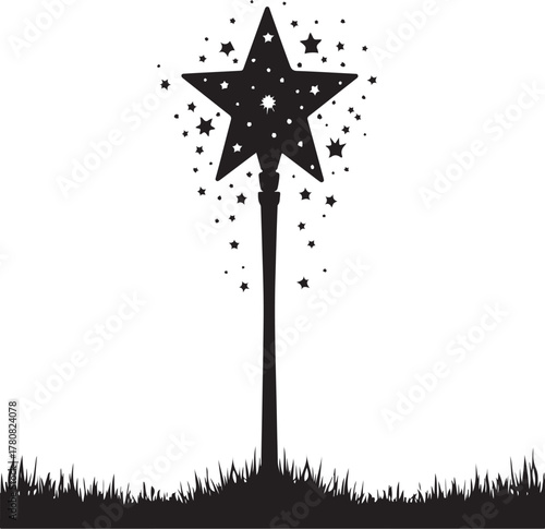 Black magic wand with stars over grass silhouette black and white