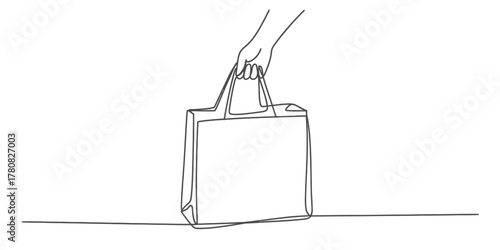 Continuous line art of a hand holding a blank reusable shopping tote bag, representing sustainable commerce, eco-friendly consumerism, and responsible purchasing habits.