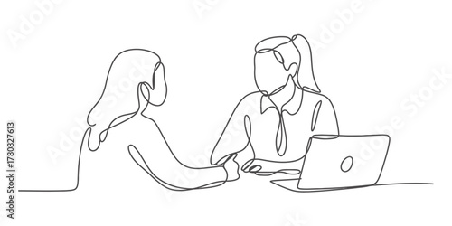 Continuous line drawing of two women collaborating at a desk with a laptop, symbolizing teamwork, discussion, and modern business communication.