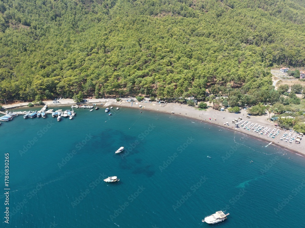 Obraz premium Tranquil Aegean Coastline and Crystal Blue Waters