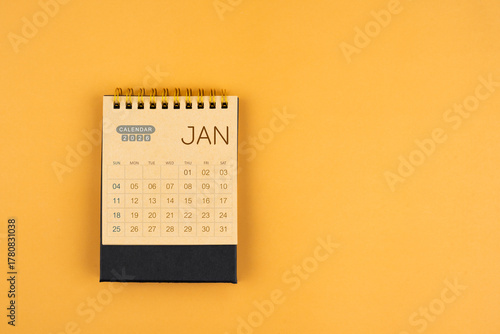 Wallpaper Mural January 2026 calendar from brown craft paper on yellow color background. Torontodigital.ca