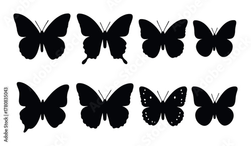Black silhouette butterflies on gradient background in various wing patterns