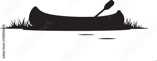Black silhouette of a canoe with paddle and grass on water