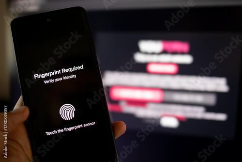 Hand using smartphone for identity verification and adult content access