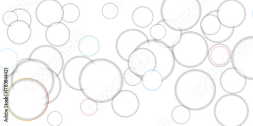 Collection of transparent soap bubbles with subtle iridescent highlights and pastel color accents floating on a clean white background, perfect for creative design elements