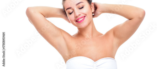Beautiful young woman holding her arms up and showing clean underarms. Armpit's care. Armpit epilation, hair removal, perfect skin.