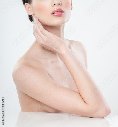 Beautiful young woman with clean skin nude topless breasts. Beautiful woman covering her nude breast. beautiful female figure. perfect skin.