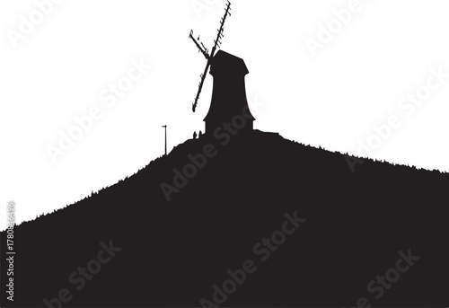 Black silhouette of a windmill on a hill black and white