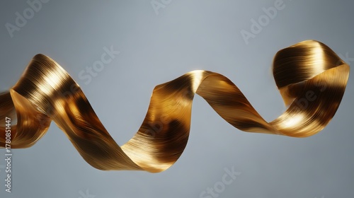 Fototapeta Naklejka Na Ścianę i Meble -  A conceptual 3D gold metallic ribbon, artfully rolled to showcase its dynamic, waving layers. 