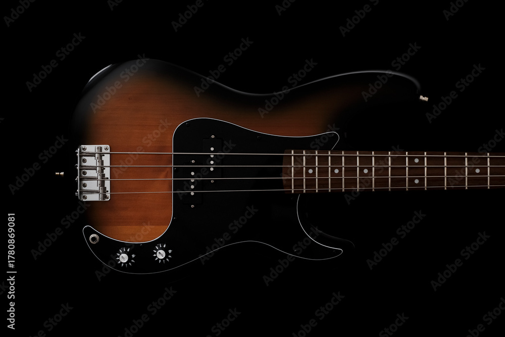 Fototapeta premium Bass guitar on black background. Music wallpaper