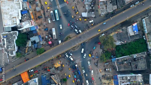 Extreme 4K Top-Down Drone View of Chaotic Indian City Traffic Overpass and Intersection.