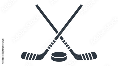 Hockey Stick and Puck Icon: An artistic representation of two crossed hockey sticks, paired with a puck, embodies the essence of the ice sport. A minimalist image with a dark hue.