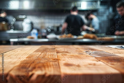 Blurred kitchen scene with chefs preparing food