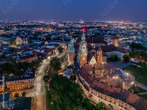 Aerial evening view of Wawel Castle in Kraków (Cracow), Poland, with illuminated walls and Vistula River