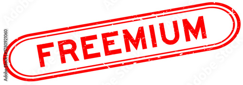 Grunge red freemium word rubber seal stamp on white background