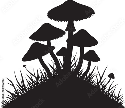 Black silhouette cluster of mushrooms growing in grass