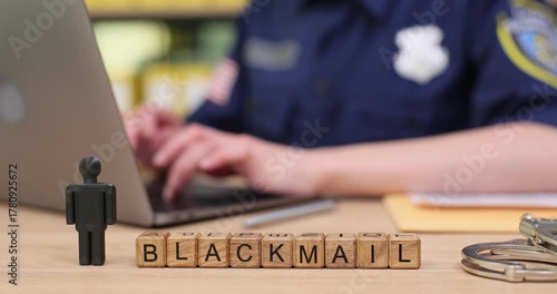 Exploring the impact of blackmail on society through a police perspective in a busy office environment