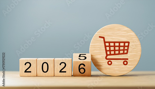 Red Shopping Cart Icon on Wooden Circle with 2025 to 2026 Year Transition Cubes