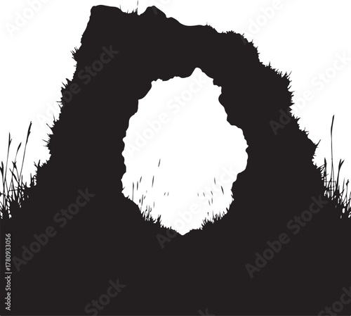 Black silhouette of an archway with grass and rocks